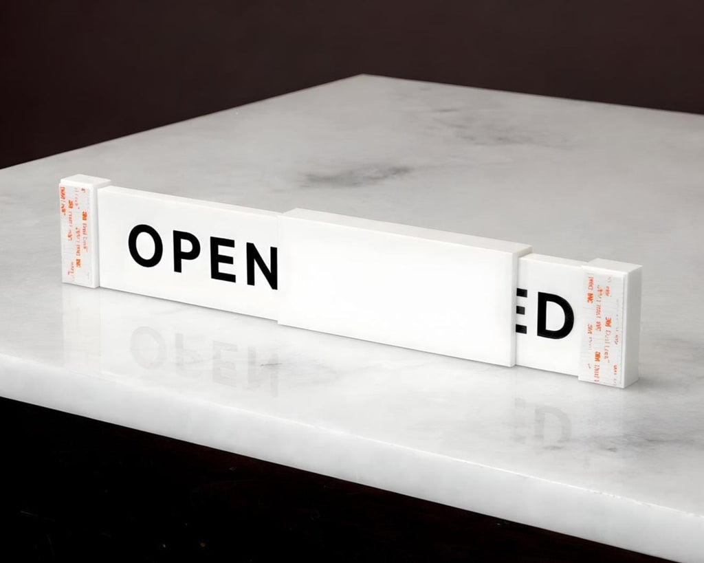LettrBoard sliding open/closed sign on a marble surface showing OPEN