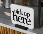 LettrBoard Pick Up Here sign with raised lettering on a dual-slot base