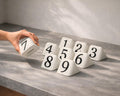 Hand arranging LettrBoard rounded triangular table numbers 1 to 9