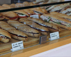 LettrBoard counter signs labeling sandwiches in a deli case