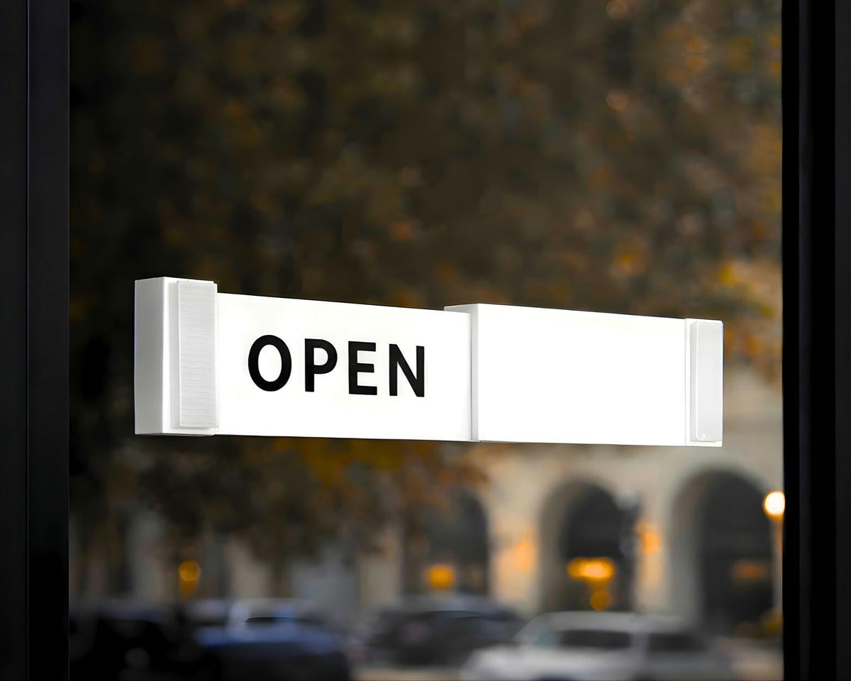 LettrBoard sliding open/closed sign showing OPEN on a glass storefront door