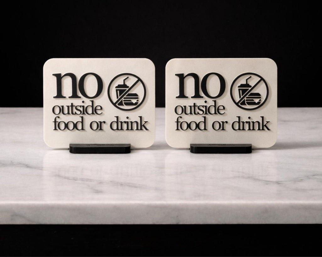 Two LettrBoard No Outside Food or Drink signs side by side