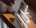 LettrBoard modular counter signs on a wooden shelf edge